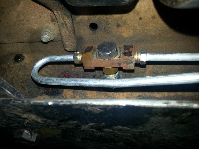 Name:  Brass brake line fitting at front driver wheel at inside frame (1).jpg
Views: 119
Size:  46.2 KB